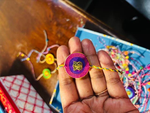 Festive Hues Ganesha Rakhi - Magenta and Purple
