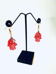 HAMSA EARRINGS IN ENIGMA ARTWORK
