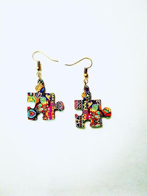 PUZZLE EARRINGS IN ARTWORK WHEN COLORS SPEAK