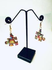 PUZZLE EARRINGS IN ARTWORK WHEN COLORS SPEAK