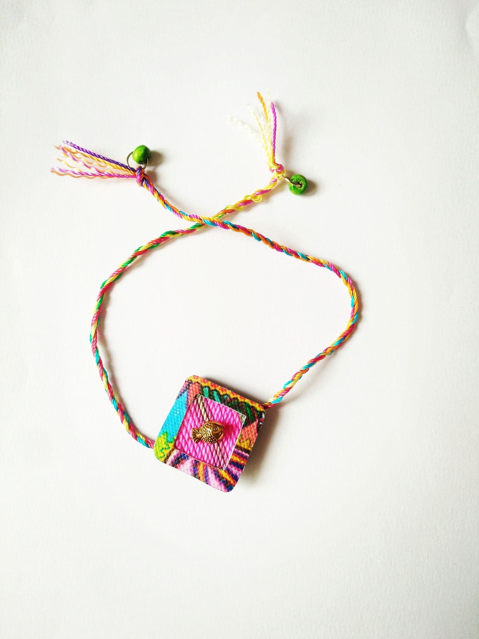 Fuscia Diamond Shaped Rakhi