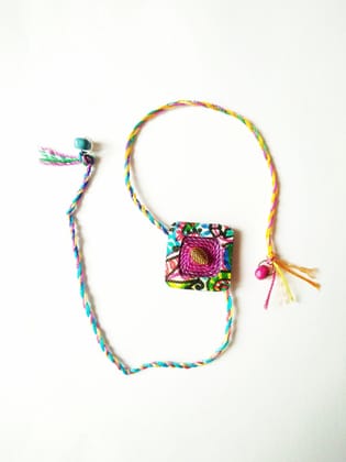 Pleasing Purple Diamond Shaped Rakhi