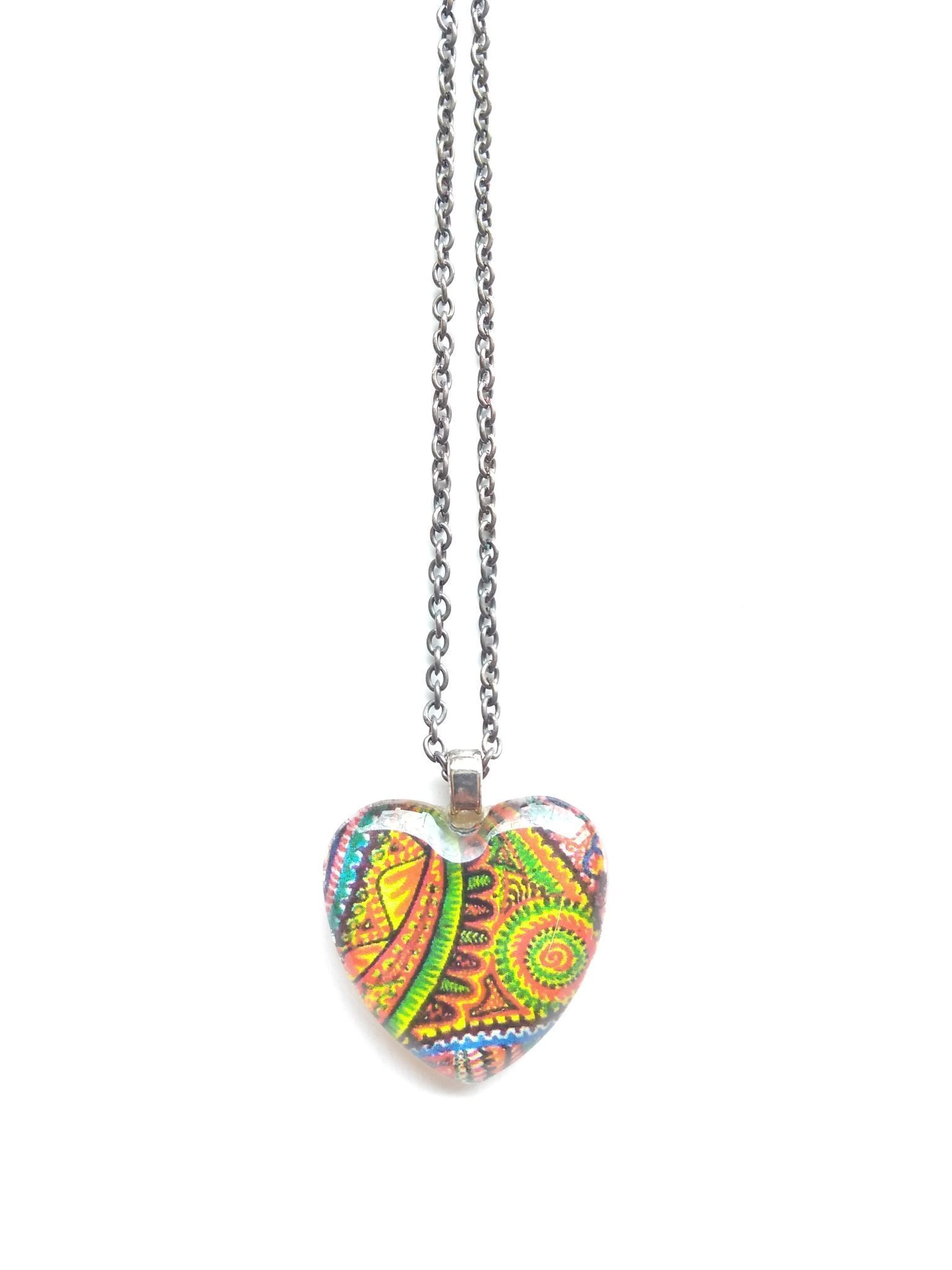 Ritzy rays in heart glass pendant
